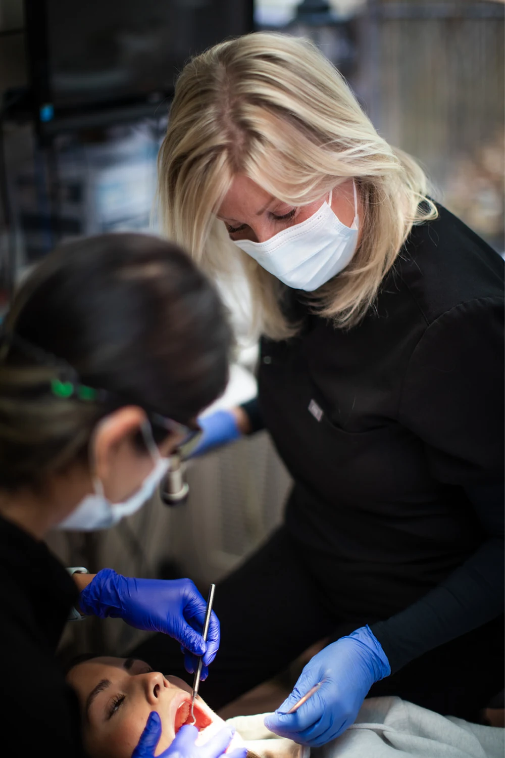 A dental team member providing care during a patient appointment